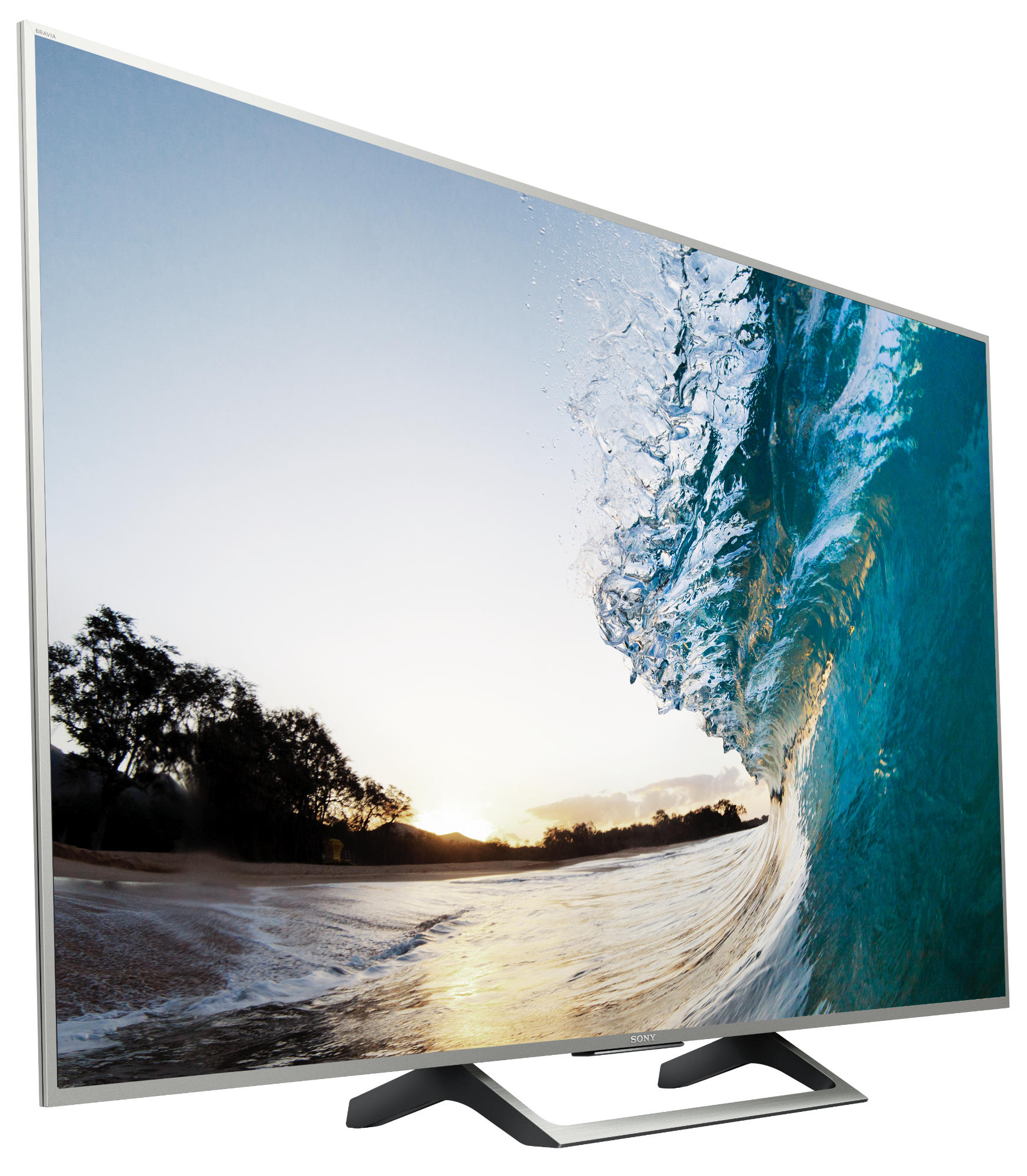 Un televisor de pantalla plana que muestra una ola en la playa. El televisor está sobre fondo blanco.
