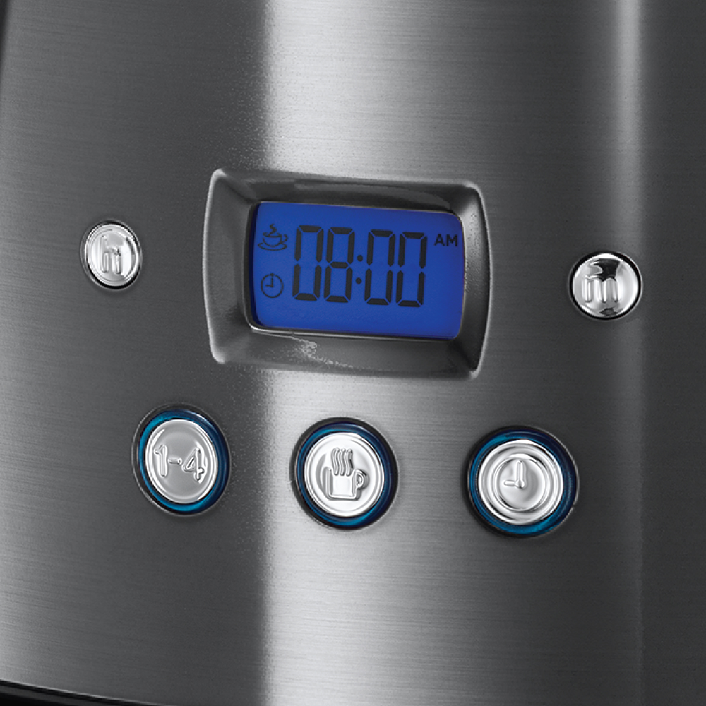 Close-up of a coffee maker's display. It shows 08:00 AM, with buttons for settings.