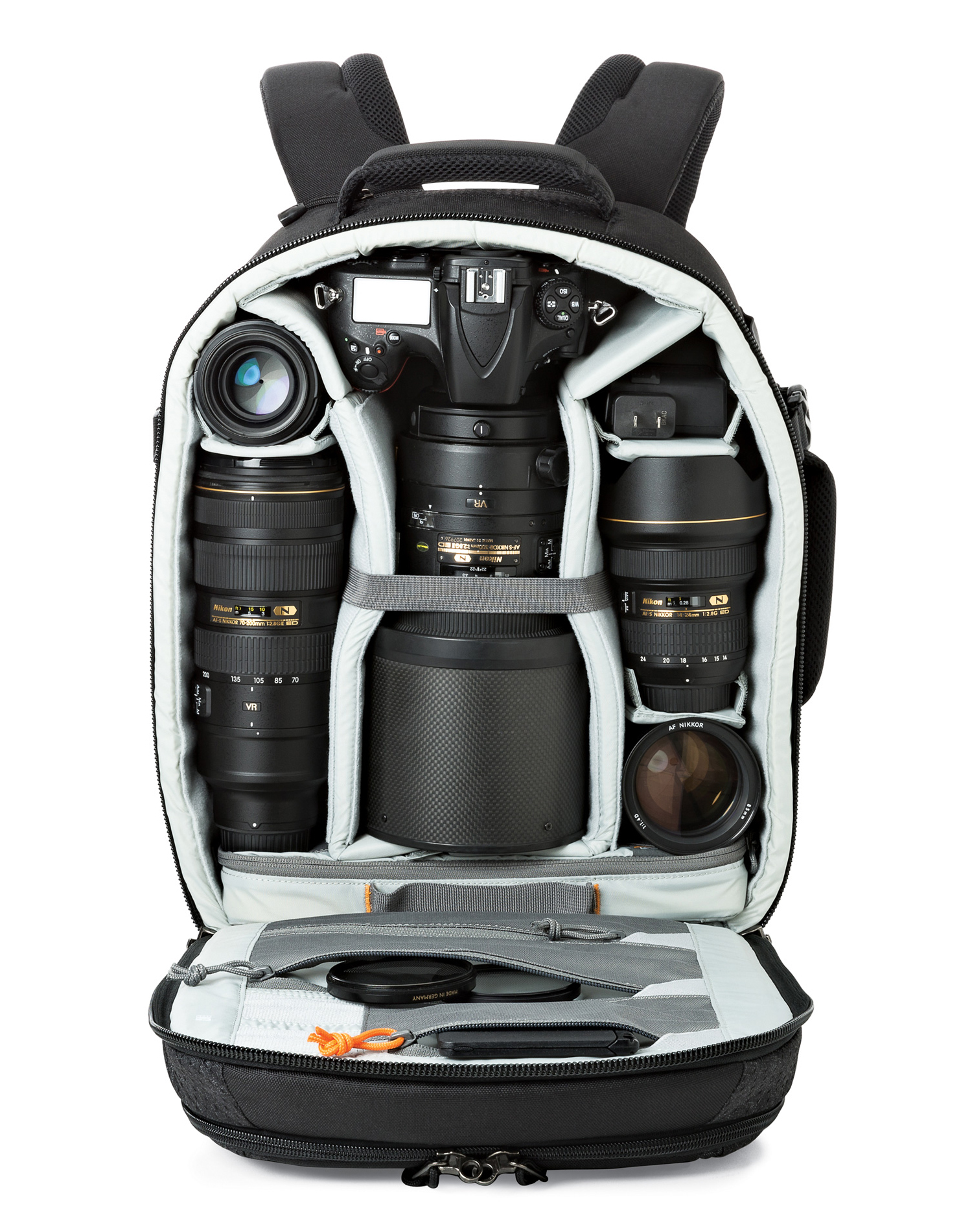 Open black camera bag with multiple lenses, a camera body, and accessories. The bag is on a white background, fully packed.