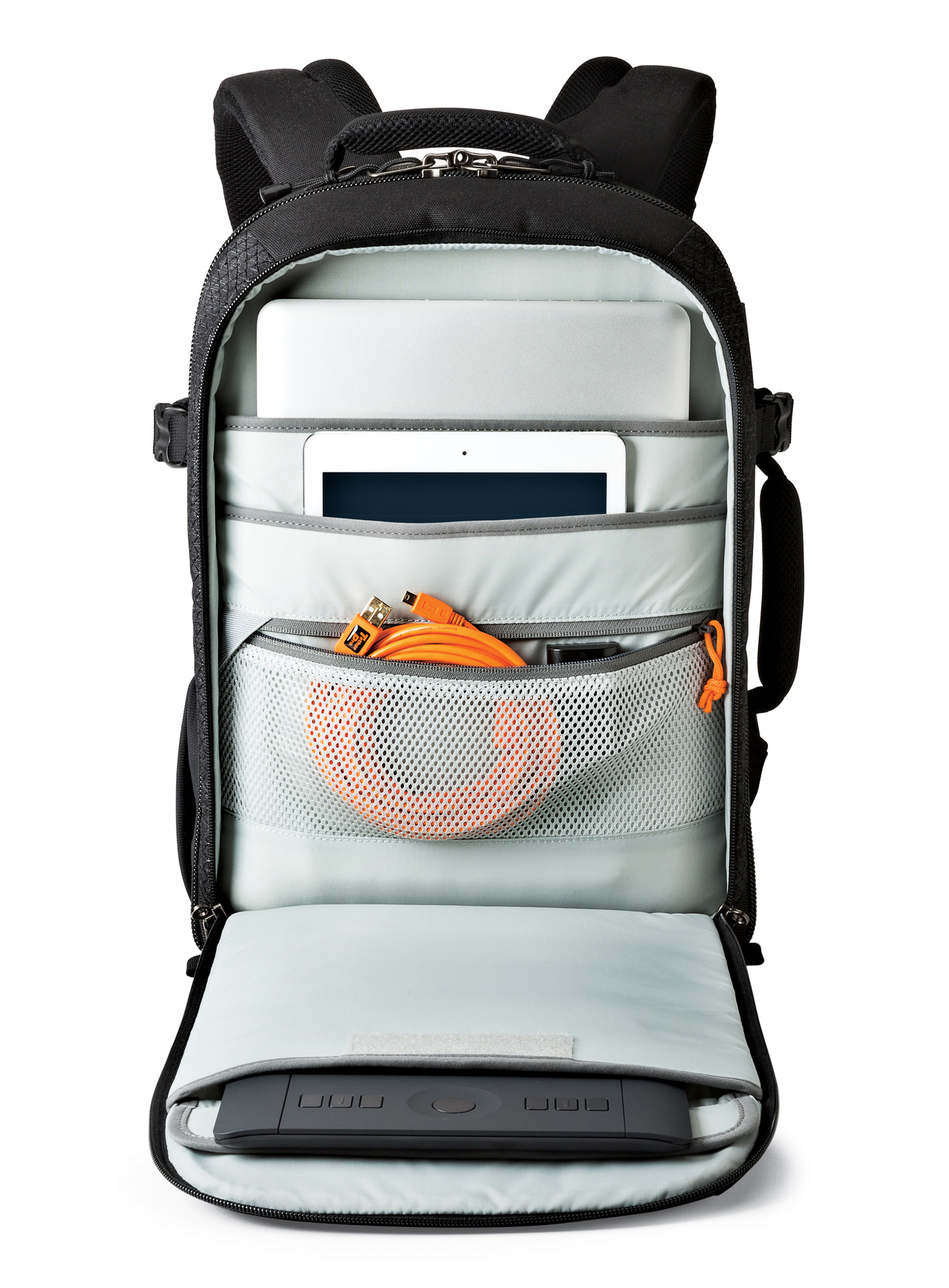 Open black backpack with laptop, tablet, orange cables, and a drawing tablet inside. White background.