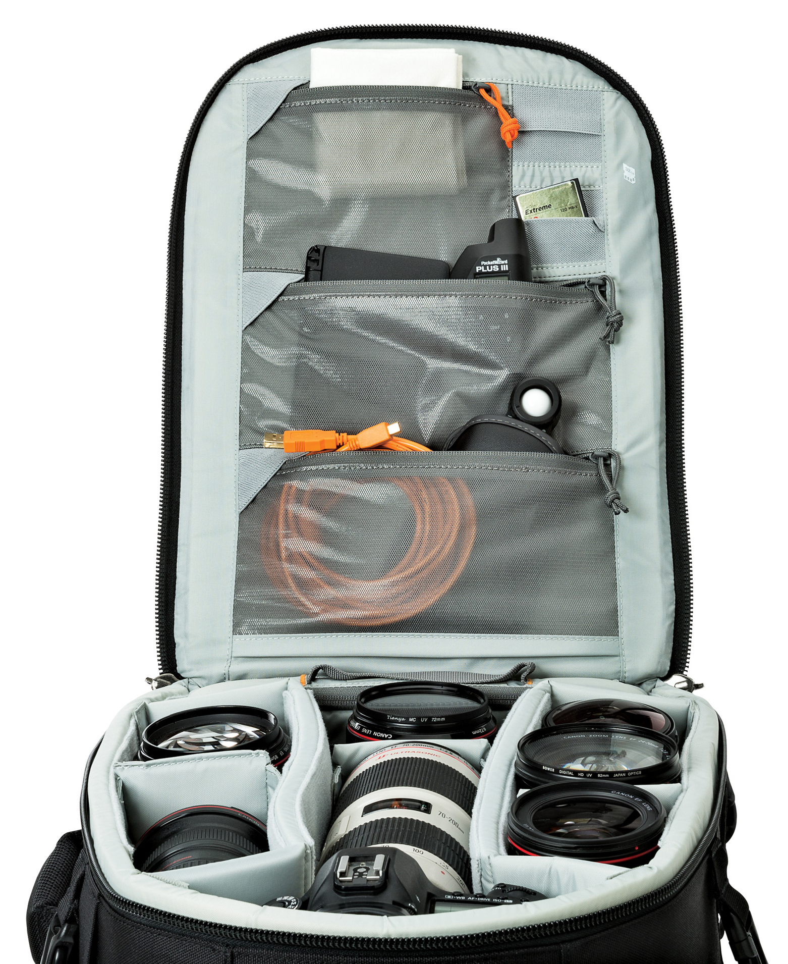 Black camera bag open, showing camera lenses, accessories, and compartments. Orange cables and SD card are visible.