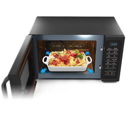 Magnetron, open. Een schaal met eten erin, met pijlaanduidingen voor de richting.