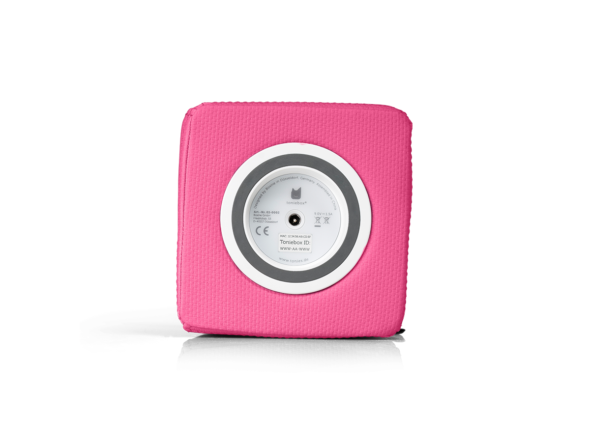 Ein rosa quadratischer Lautsprecher mit einem weißen und grauen Kreis in der Mitte. Der Kreis hat Text, ein Logo und ein CE-Symbol.