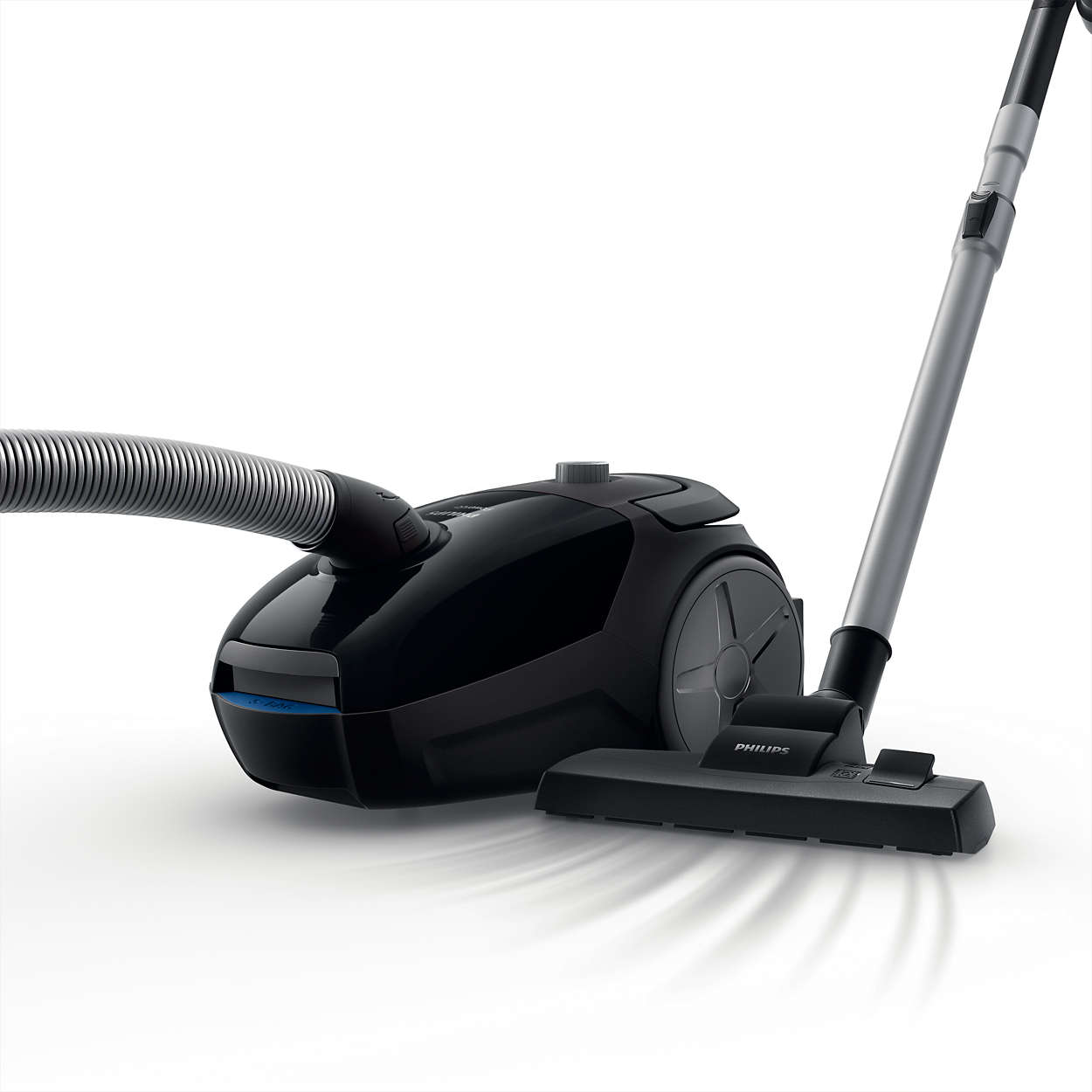 Black vacuum cleaner on white. It has a hose, a handle, and a brush head.
