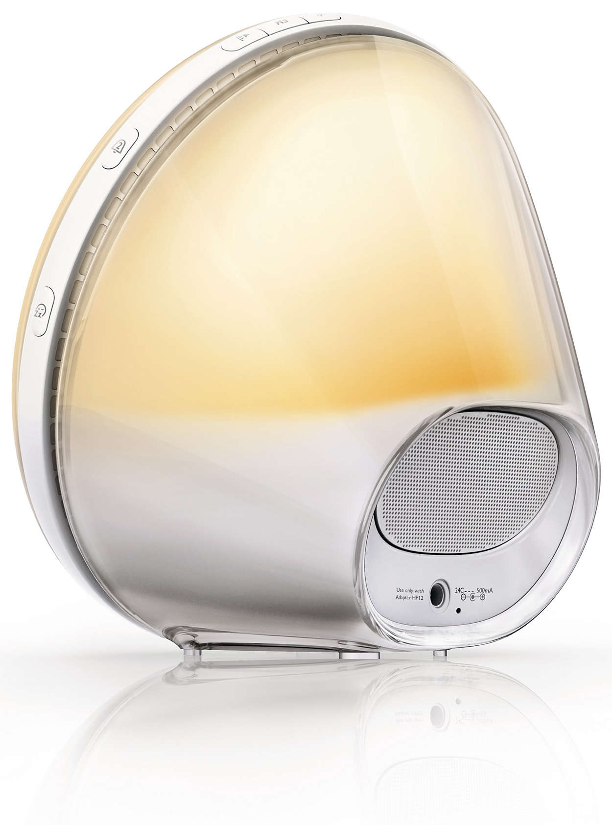 Une lampe de chevet blanche et transparente avec un haut-parleur et des boutons. Le fond est blanc.