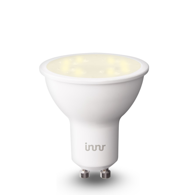 White LED spotlight bulb with a silver base, emitting soft light.