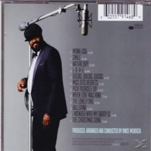 Couverture de CD, homme noir en costume, microphone et liste des titres au dos.