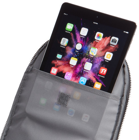 Tablet in a gray case, with screen showing colorful images, inside a pocket of the case.