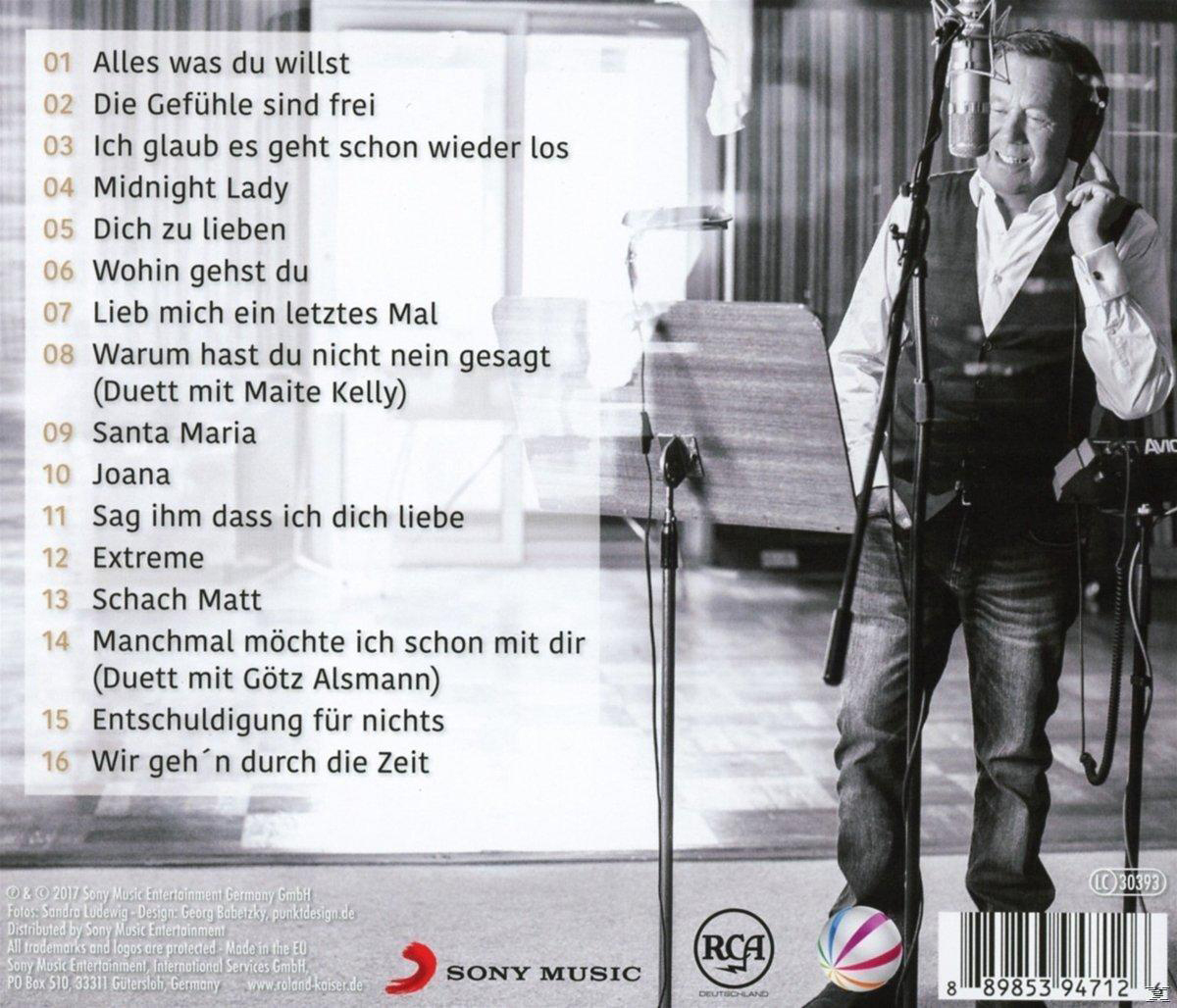 CD-Rückseite mit Titelliste und Foto eines Mannes, der ins Mikrofon singt.