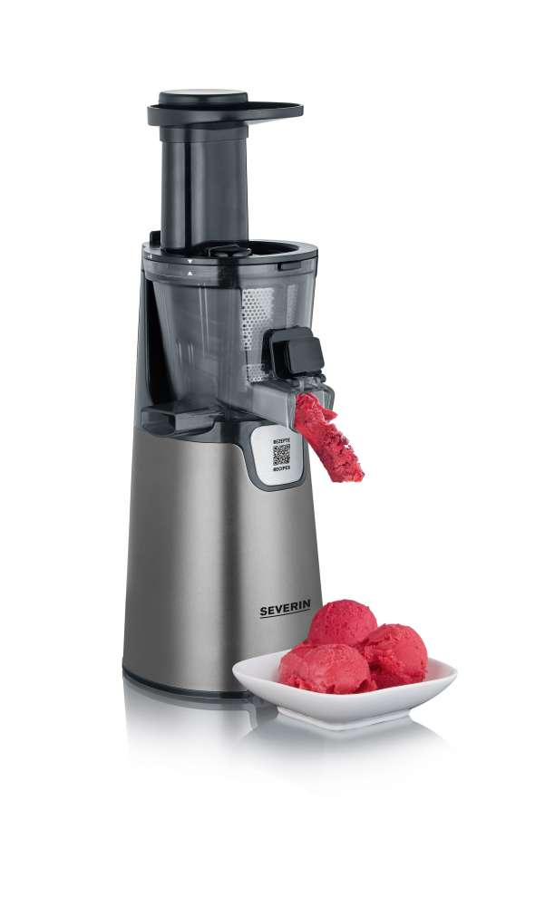 A silver and black juicer with a white bowl containing red sorbet and a piece of sorbet being squeezed.