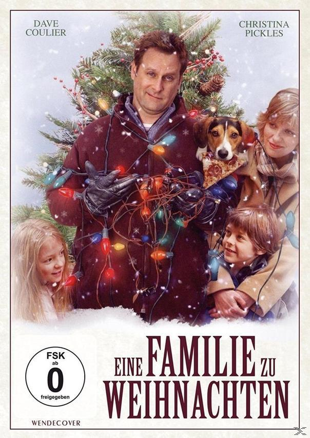 DVD-Cover mit Mann, Kindern und Hund mit Weihnachtsbeleuchtung.
