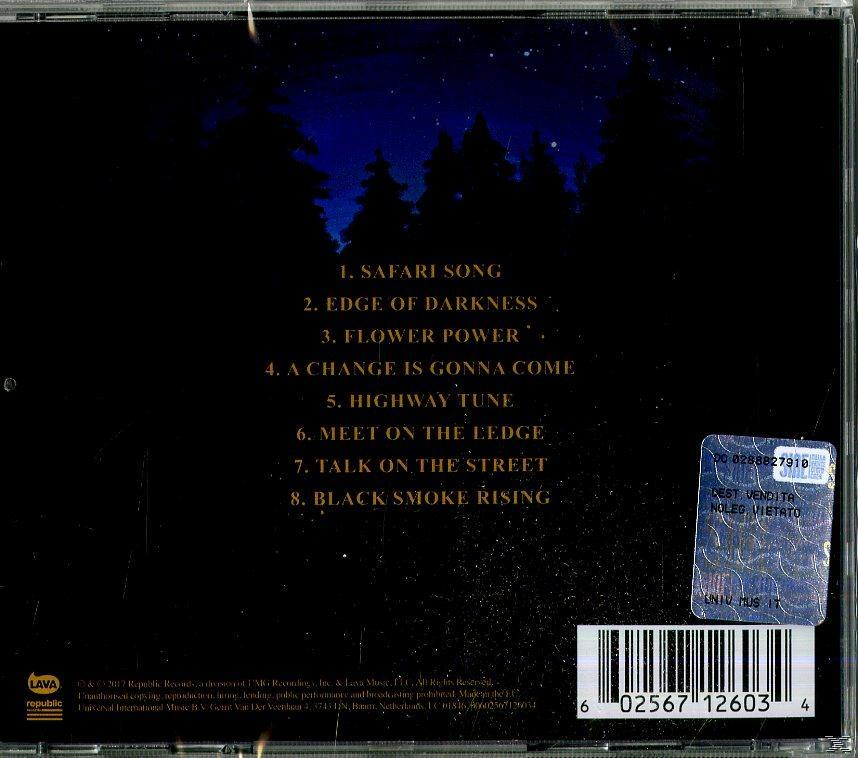 Le dos d'un boîtier de CD avec les titres des chansons, les crédits de l'album et un code-barres. Fond bleu foncé.
