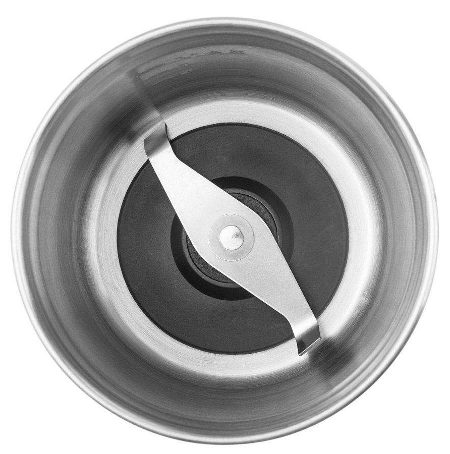 Inside of a food grinder. A silver blade is in the middle.