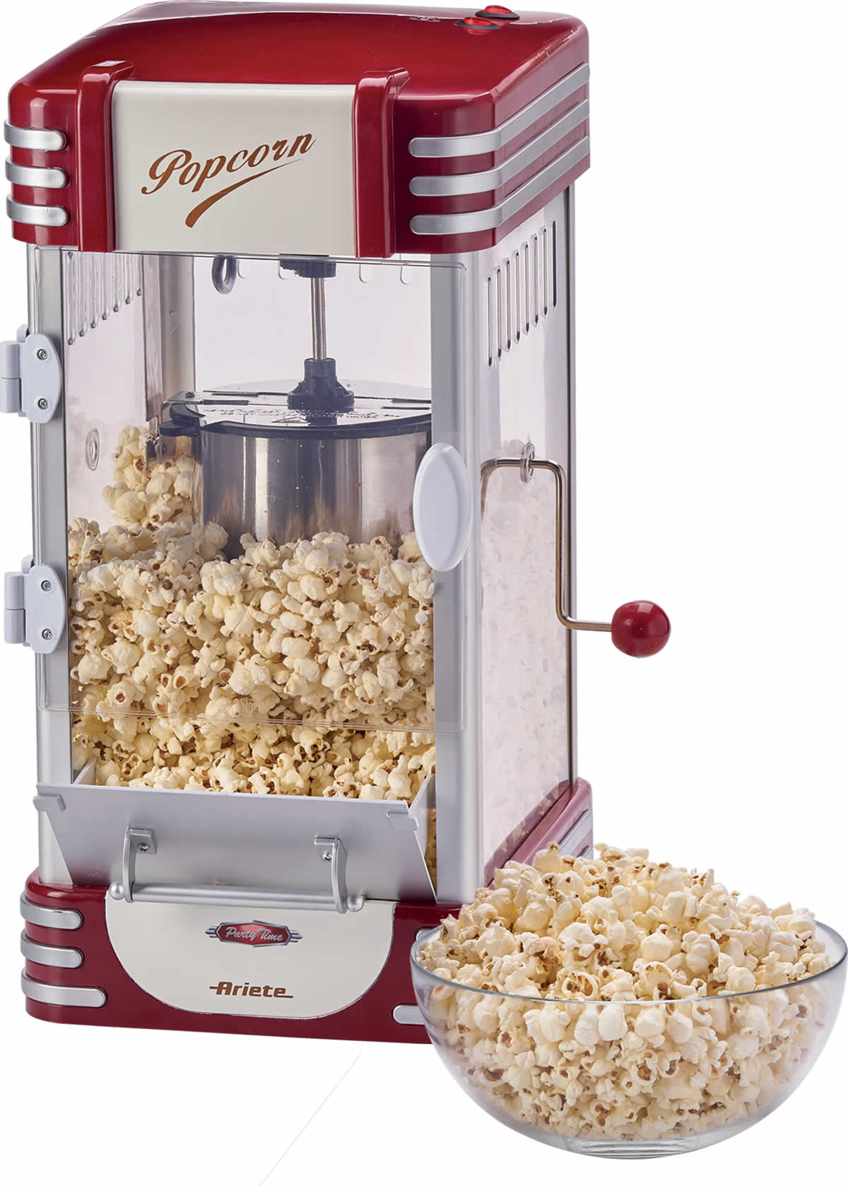 Rode en crèmekleurige popcornmachine met een glazen voorkant, gevuld met popcorn en een kom.