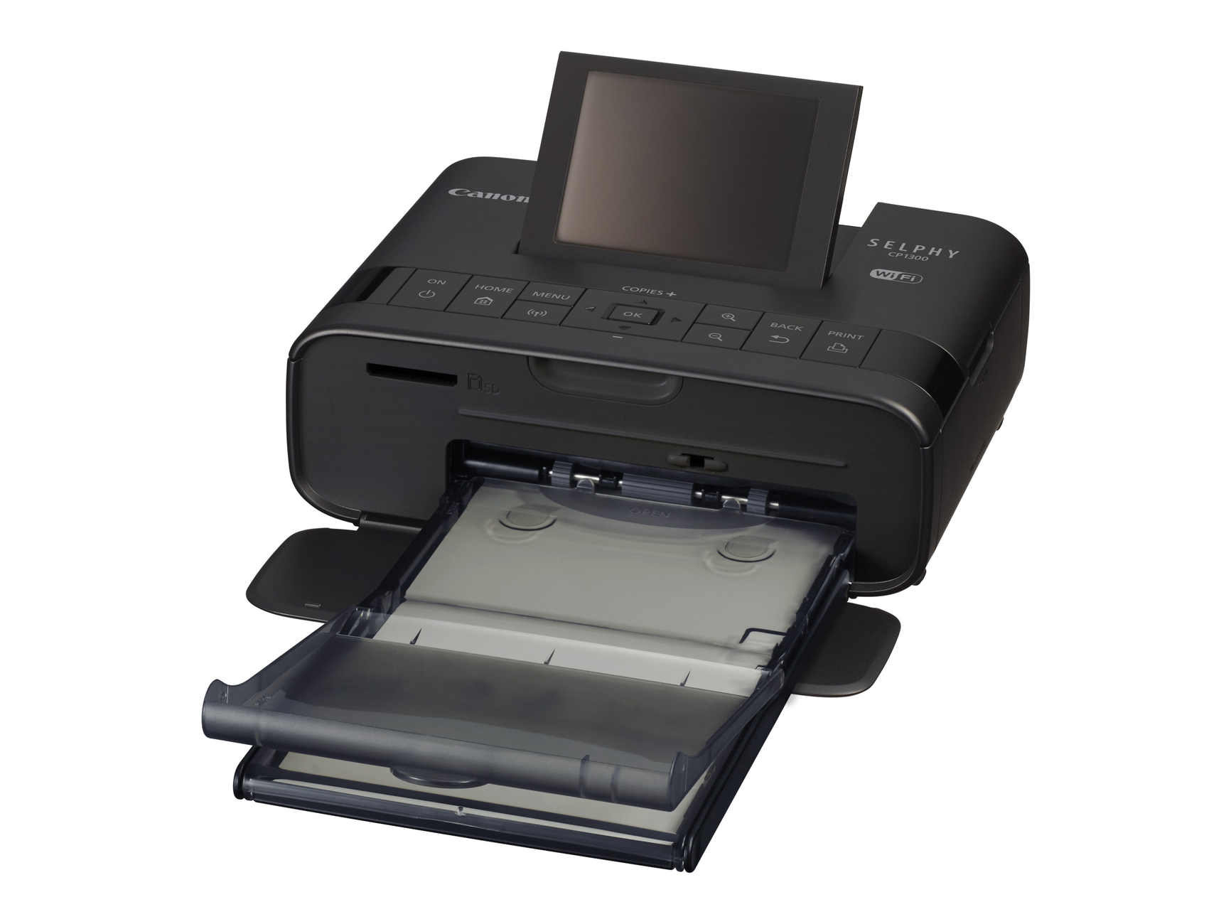 Black Canon Selphy CP1300 printer with a screen. The paper tray is open. White background.