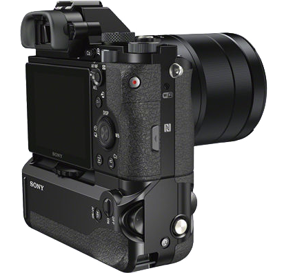 Black camera with a grip, display and lens. Buttons on the back and side.