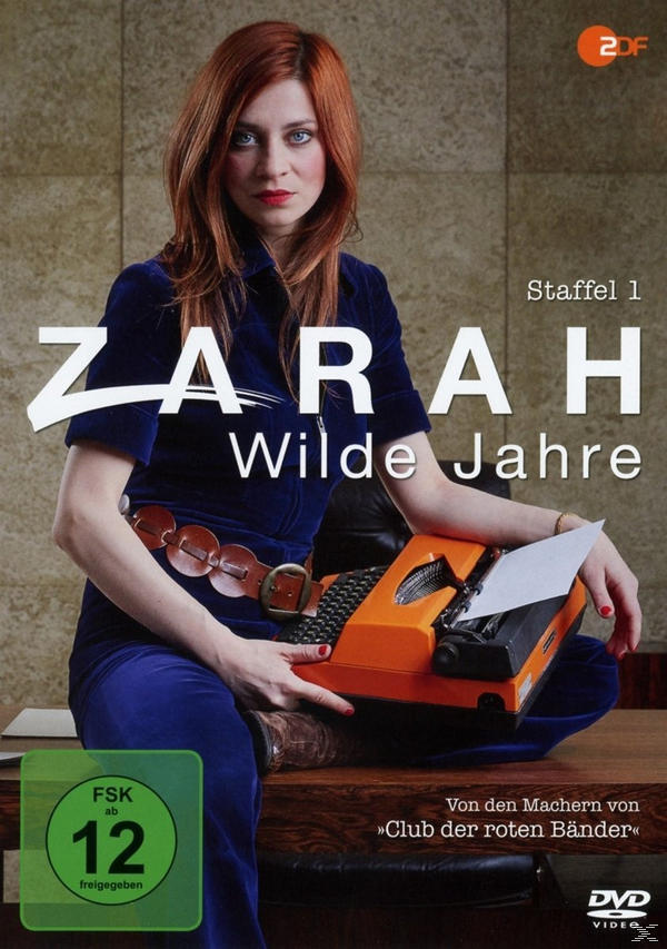 DVD-Cover von Zarah-Wilde Jahre, eine Frau in Blau, hält eine orangefarbene Schreibmaschine, rotes Haar.