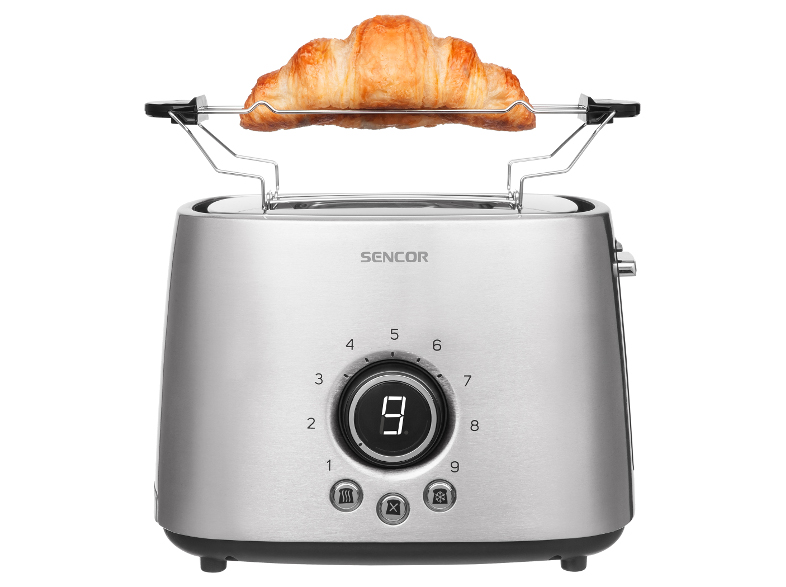 Egy ezüst kenyérpirító tetején egy croissant-val. A kenyérpirítón egy '9'-es számot mutató digitális kijelző van.