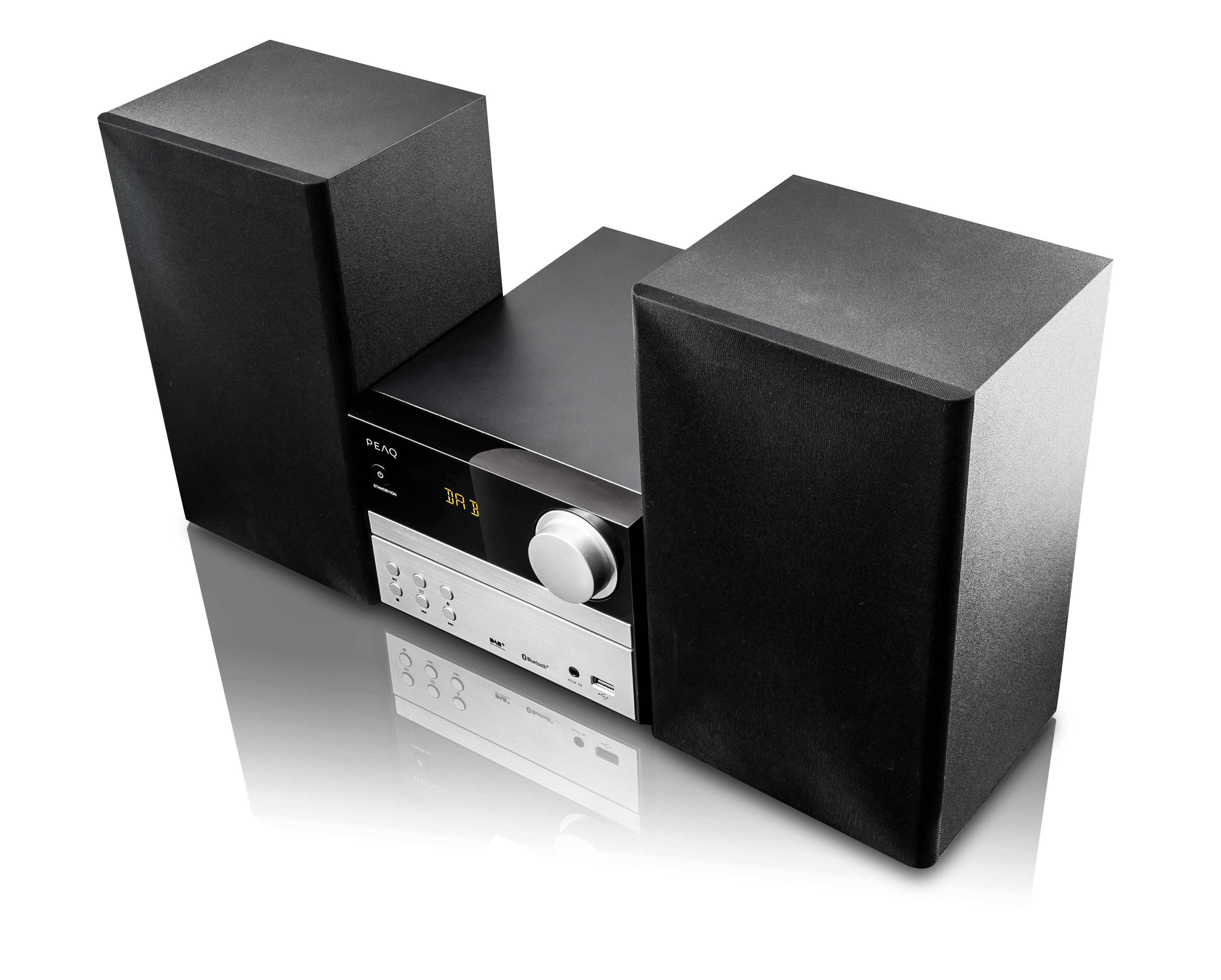 Mini-HiFi-System mit zwei schwarzen Lautsprechern neben einer silber-schwarzen Steuereinheit.
