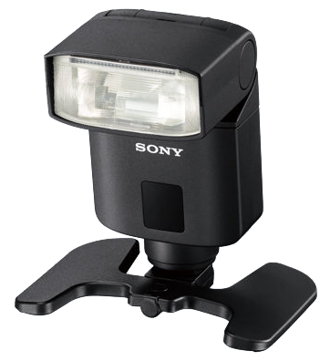 Black camera flash with a Sony logo and base. It is mounted on a stand.