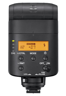 A black external flash unit with buttons, dials and a small orange display on the front.