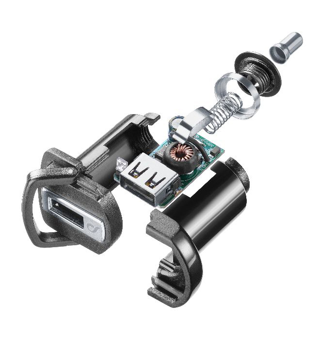 Composants démontés d'un appareil électrique. Fils et pièces internes visibles.