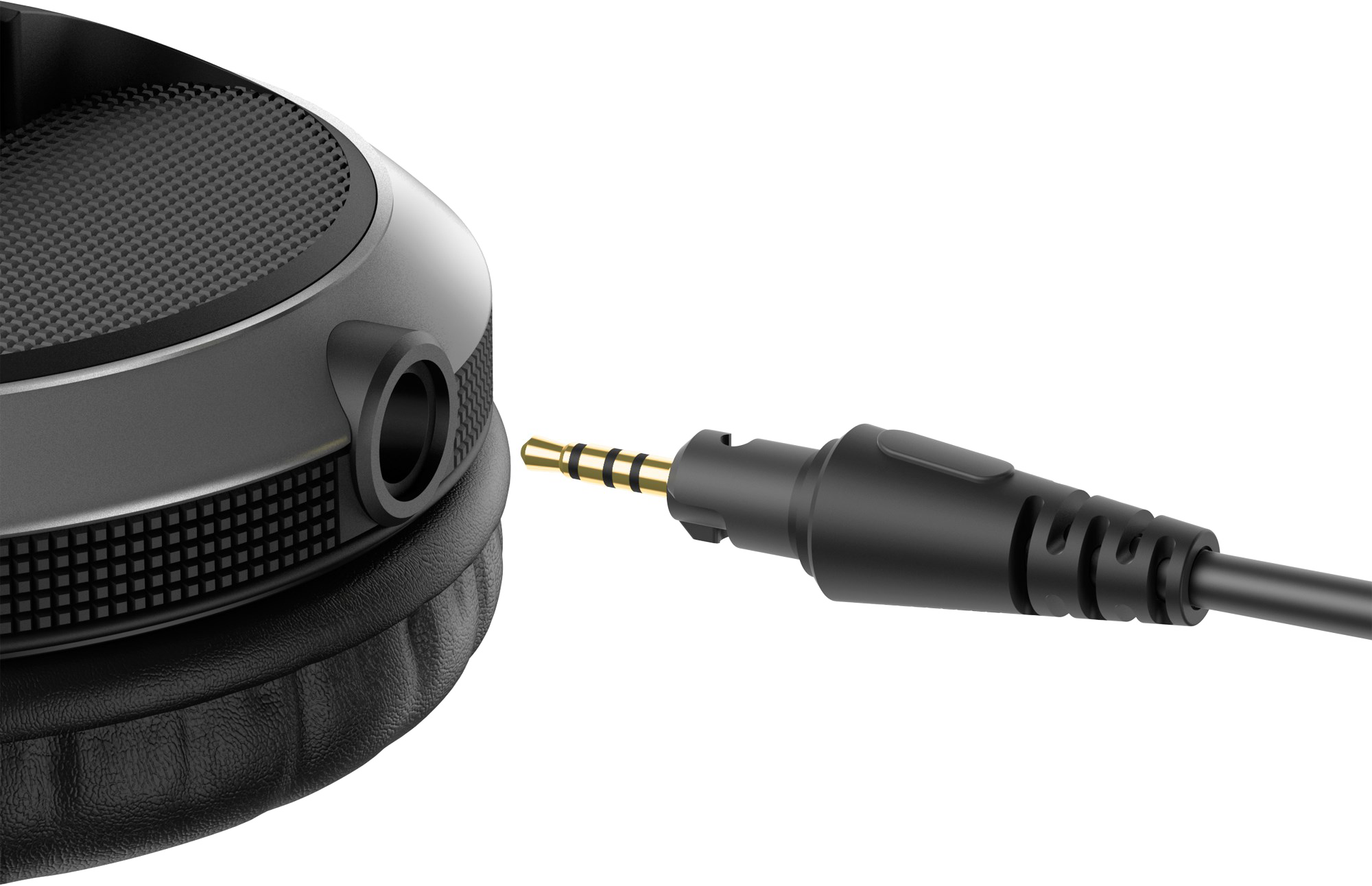 Close up of a headphone jack plugged into a black headphone. Black background.