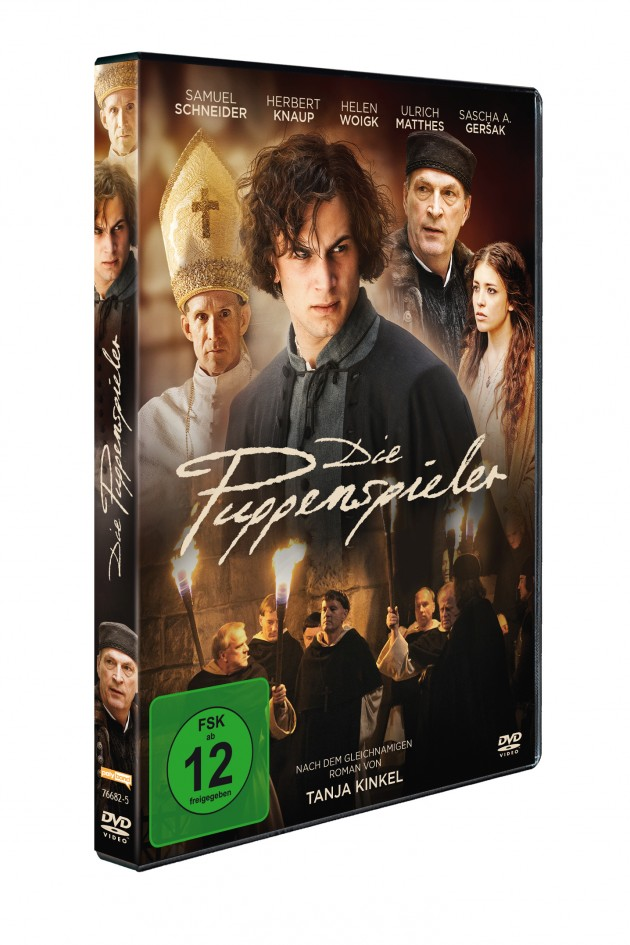 DVD-Hülle mit dem Film Die Puppenspieler, mit Schauspielern auf dem Cover. Grünes FSK 12 Logo sichtbar.