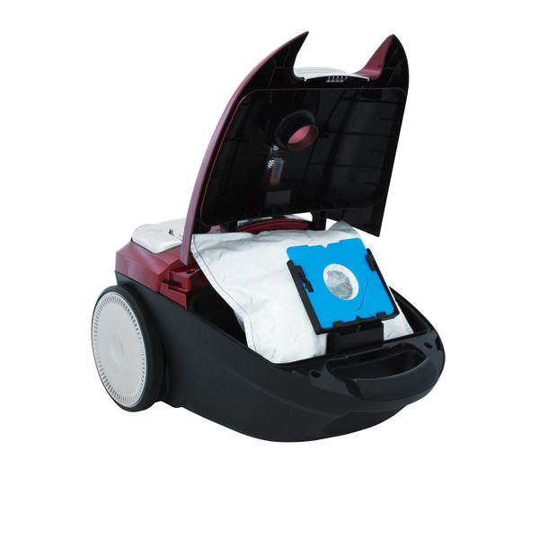 A red and black vacuum cleaner with its top open, revealing a white bag inside. The cleaner has a blue filter.