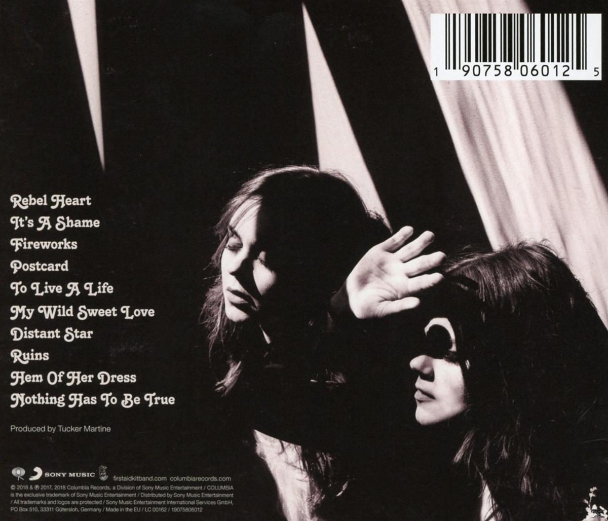 Albumhoes met twee vrouwen in de schaduw. Songtitels links. Barcode en Sony Music logo zichtbaar.