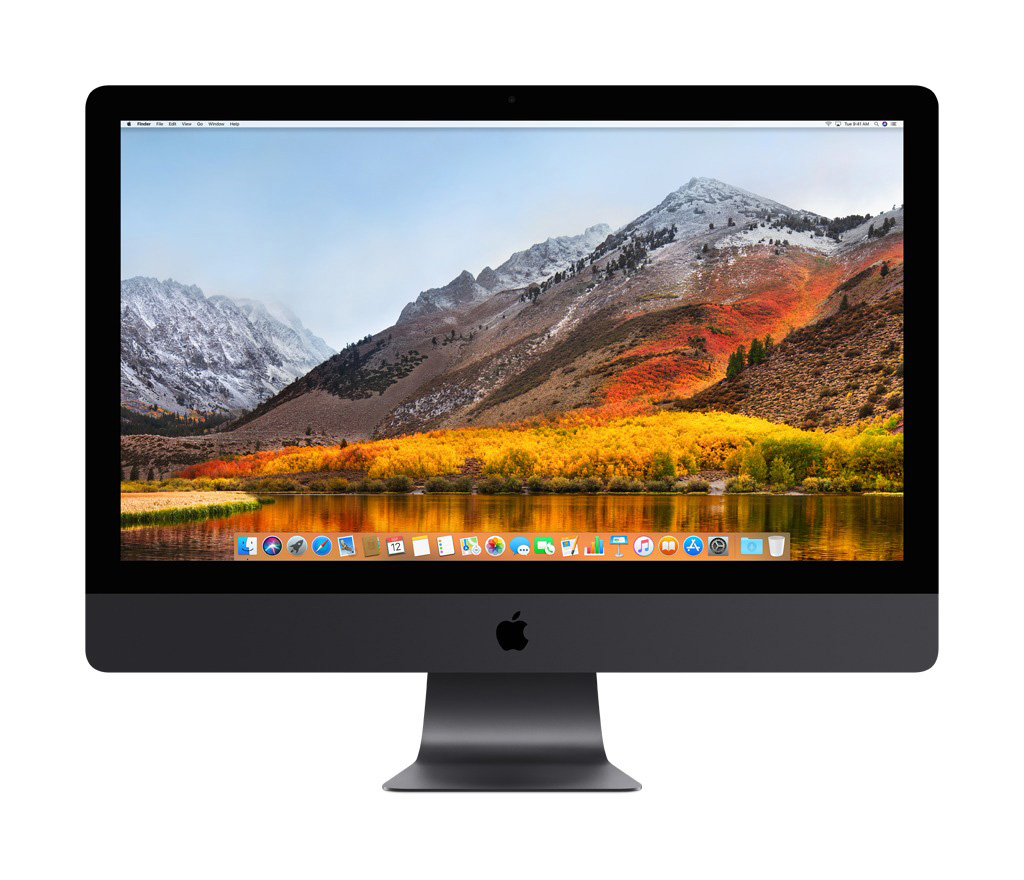 Ein Apple iMac Computer mit einer Berglandschaft auf dem Bildschirm. Weißer Hintergrund.