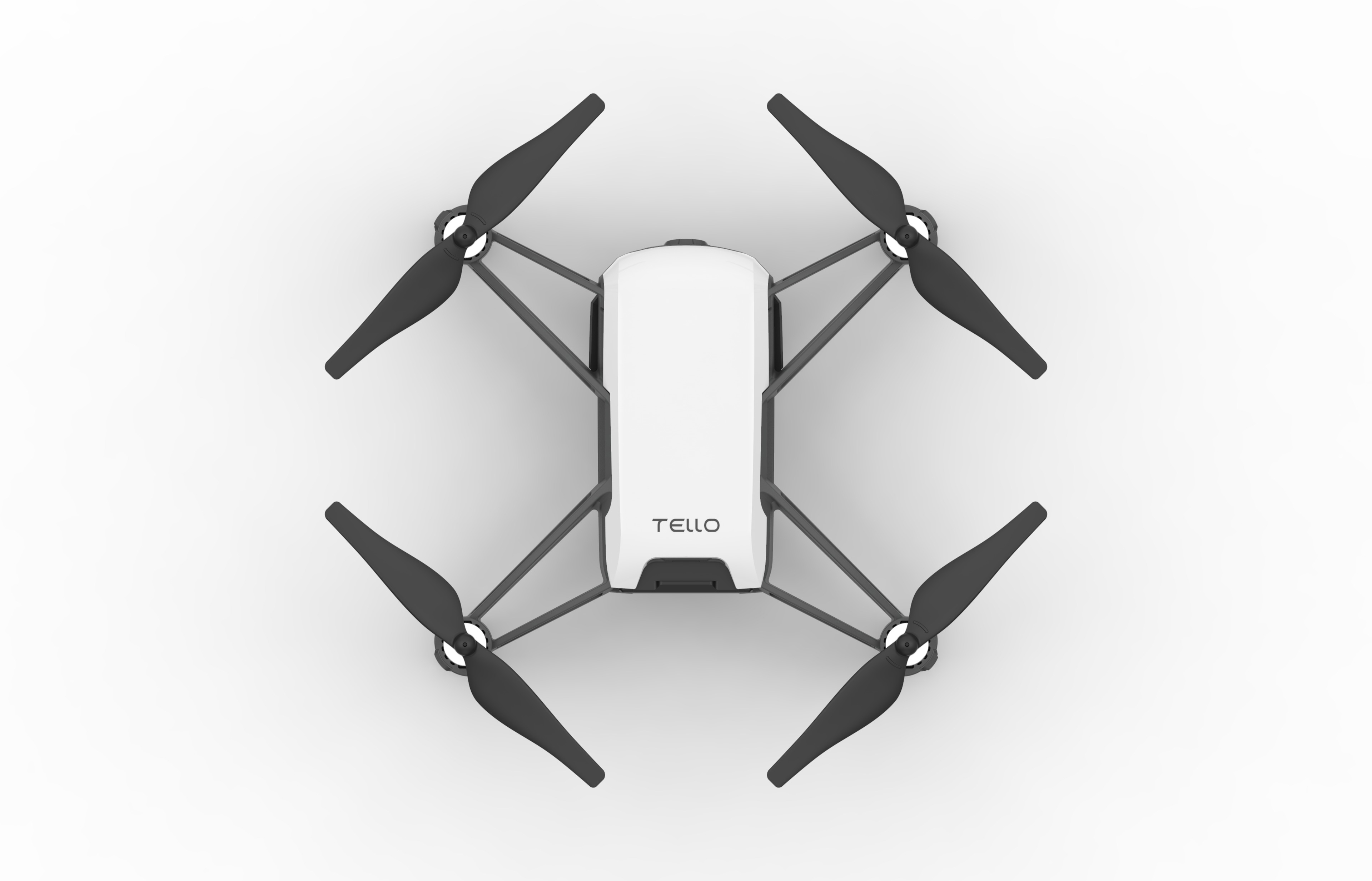 Eine weiße und graue Tello-Drohne, Draufsicht, mit vier schwarzen Propellern und dem Tello-Logo.