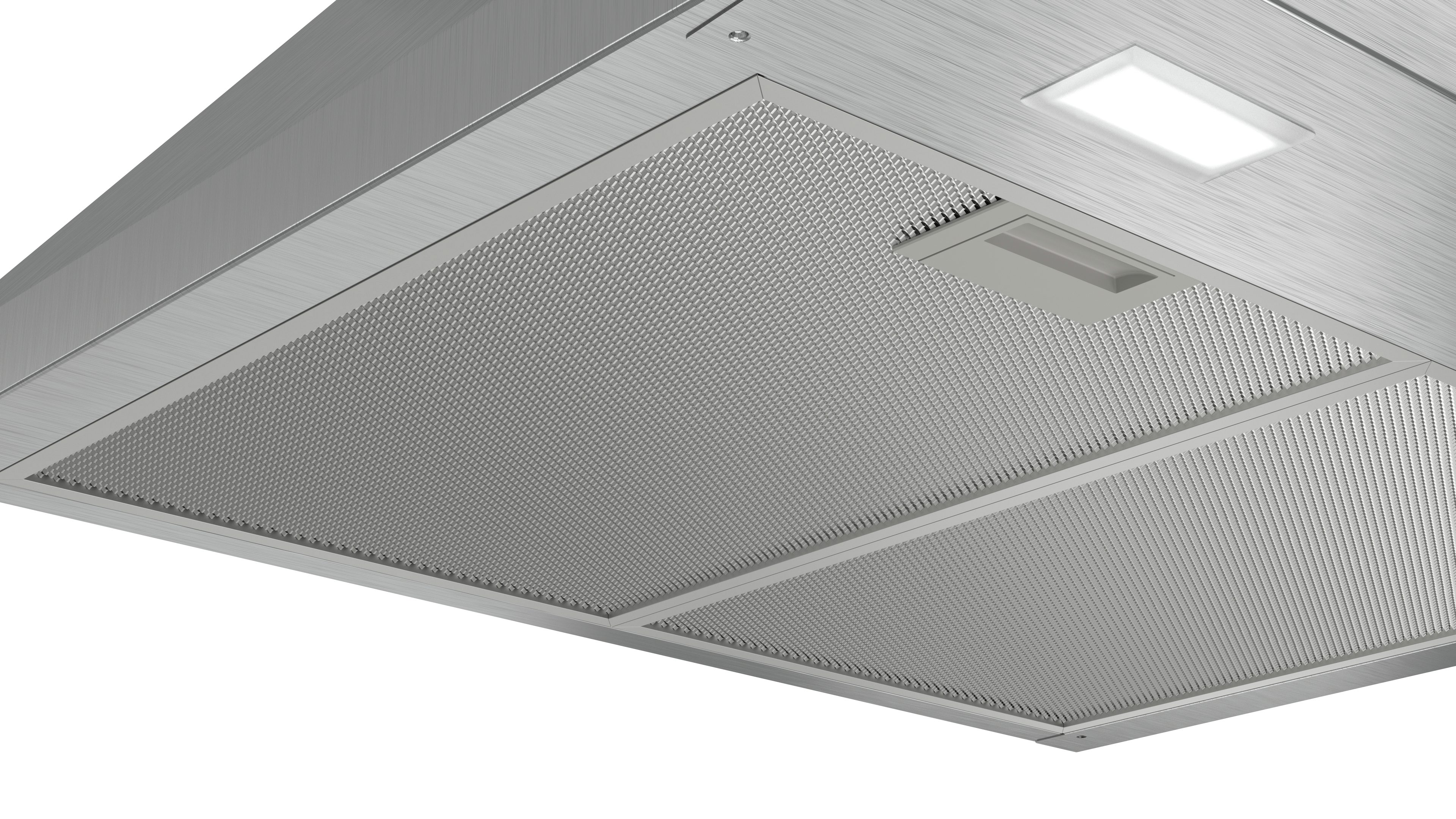 Close-up, stainless steel range hood with a metal mesh filter and a bright, square light.