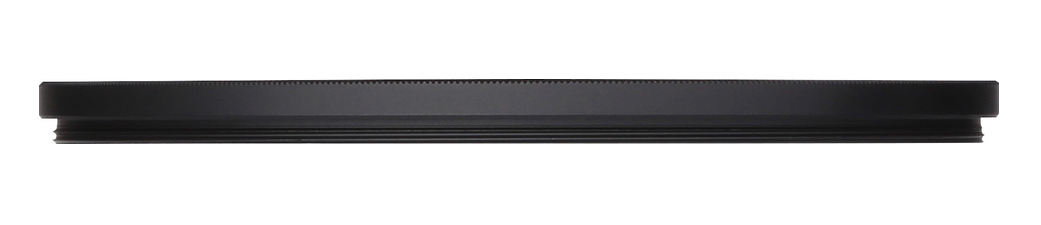 A black lens cap lies horizontally. It has a ridged edge, and a smaller inner section, against a white background.