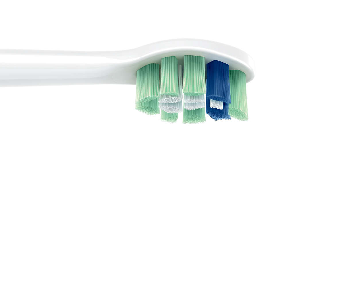 Gros plan d'une tête de brosse à dents électrique. Soies vertes, blanches et bleues.