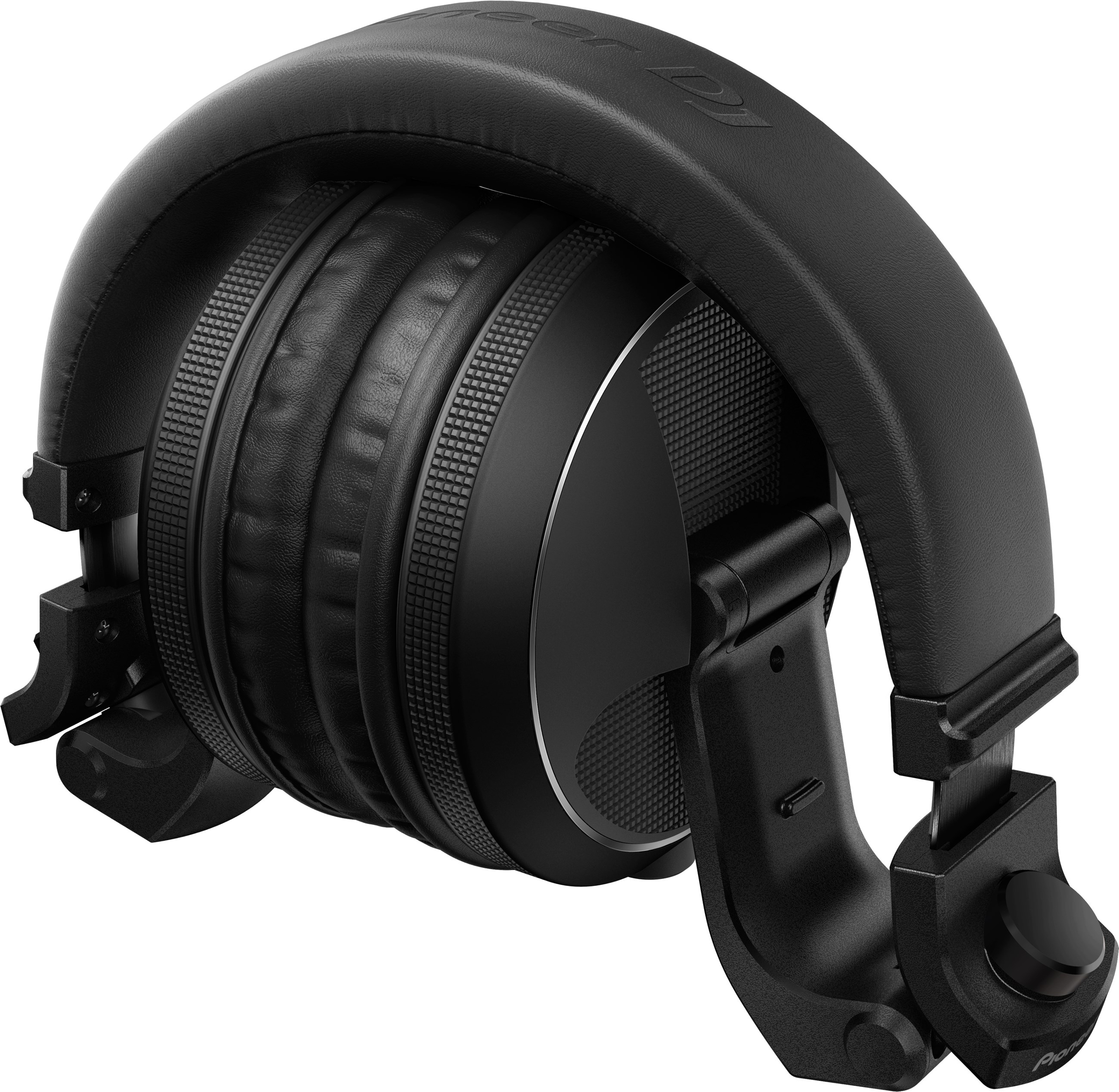 Zwarte over-ear koptelefoon, opgevouwen en op een oppervlak. Merk Pioneer DJ.