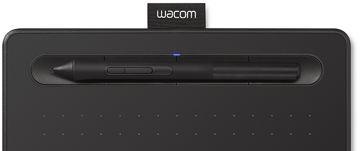 Black Wacom tablet with stylus. Stylus in the slot. White background.