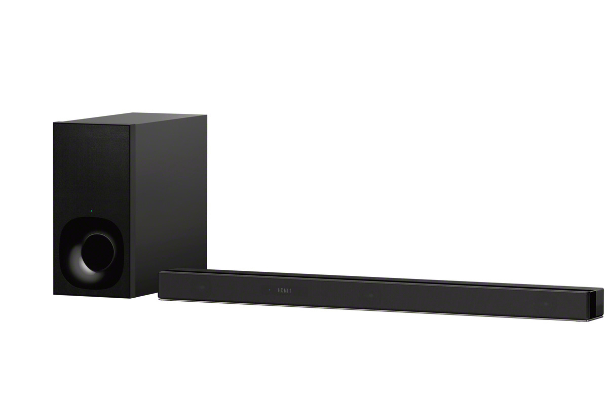 Schwarze Soundbar mit Subwoofer. Soundbar ist lang und schlank, mit schwarzem Subwoofer links. Weißer Hintergrund.