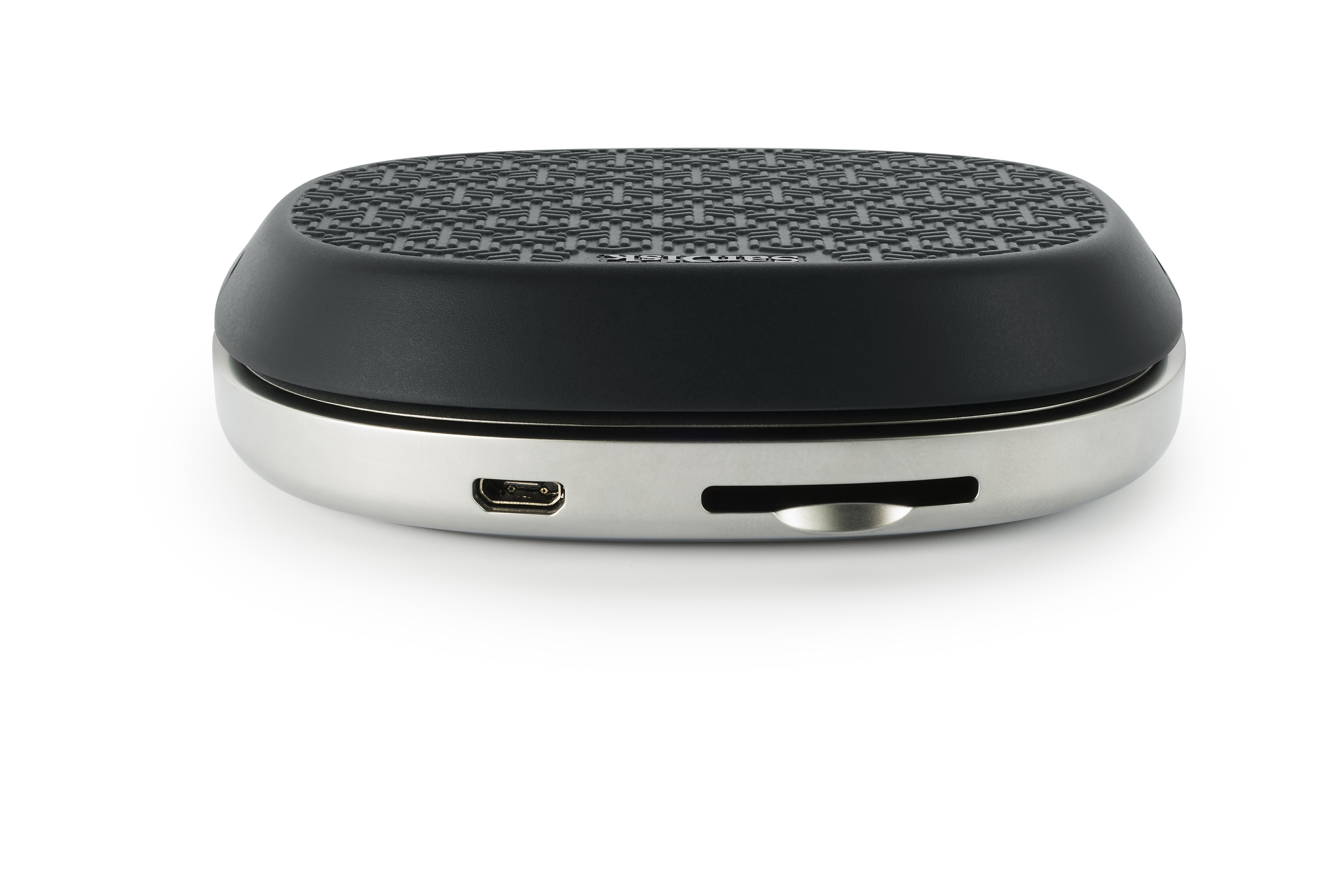 Silver and black device with a USB port, card slot, and textured top.