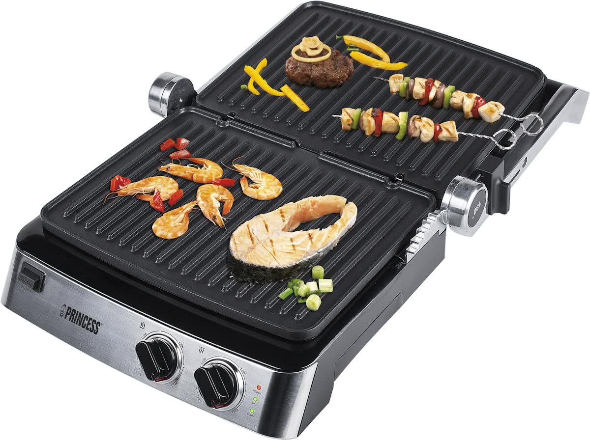 Electric grill with grilled food, including steak and skewers.