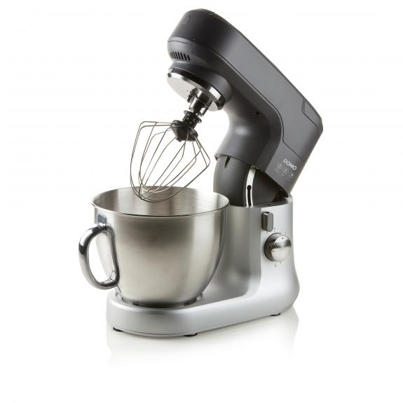 A silver and black stand mixer with a bowl and whisk attachment.