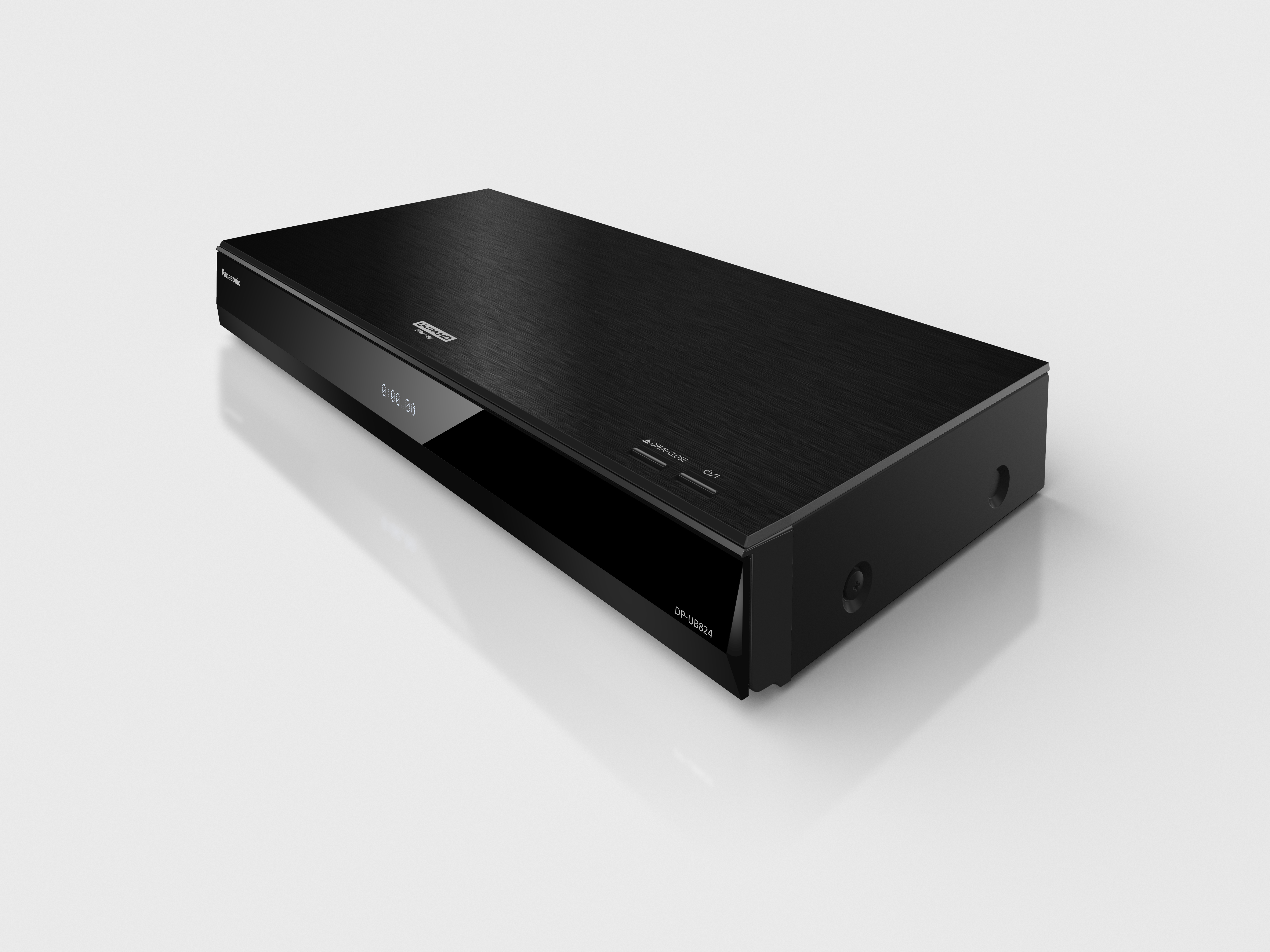Ein schwarzer Blu-ray-Player. Er ist rechteckig und hat ein Display. Der Hintergrund ist hellgrau.
