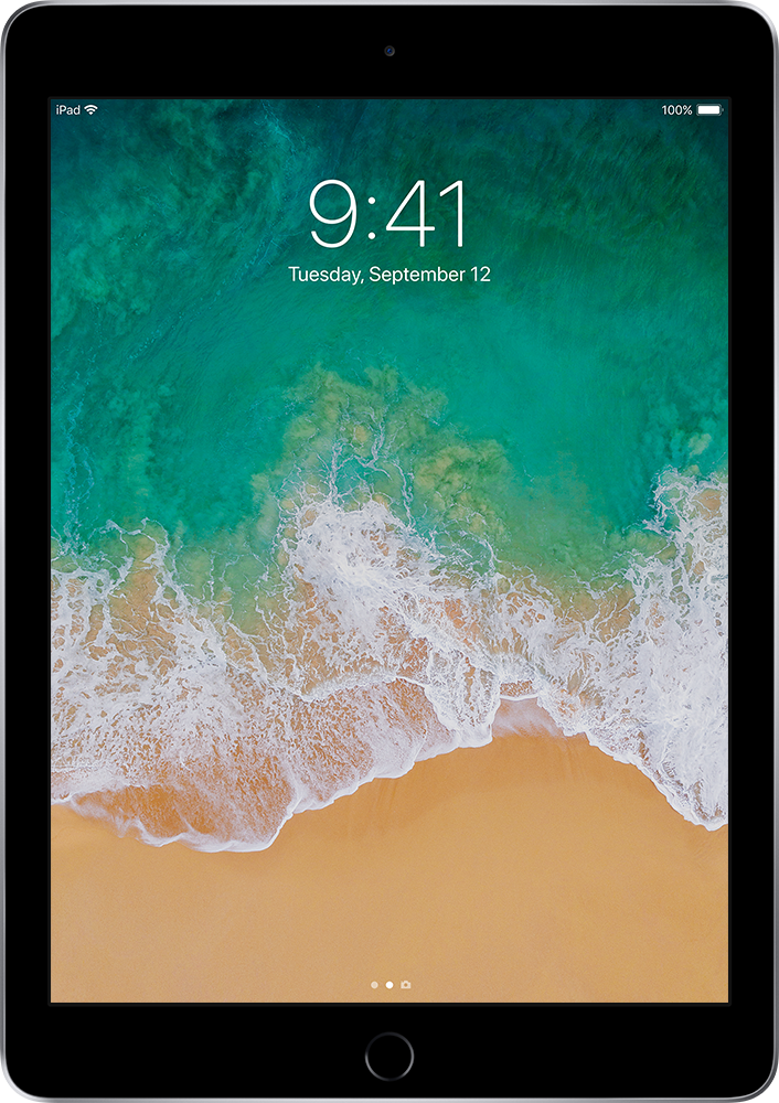 Écran noir d'iPad affichant une scène de plage et l'heure, avec le bord noir de l'iPad.