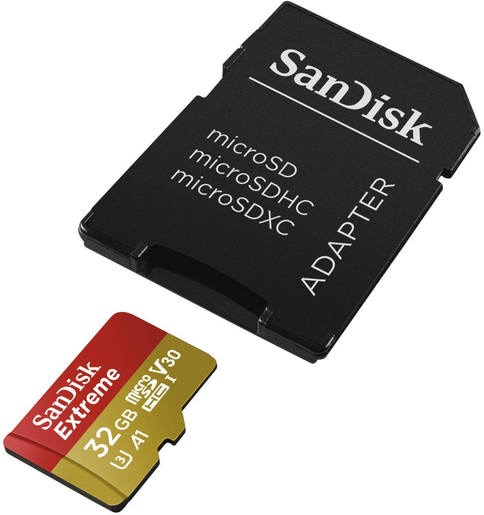 Carte mémoire et adaptateur Sandisk. La carte est rouge et jaune, avec une étiquette de 32 Go. L'adaptateur est noir.