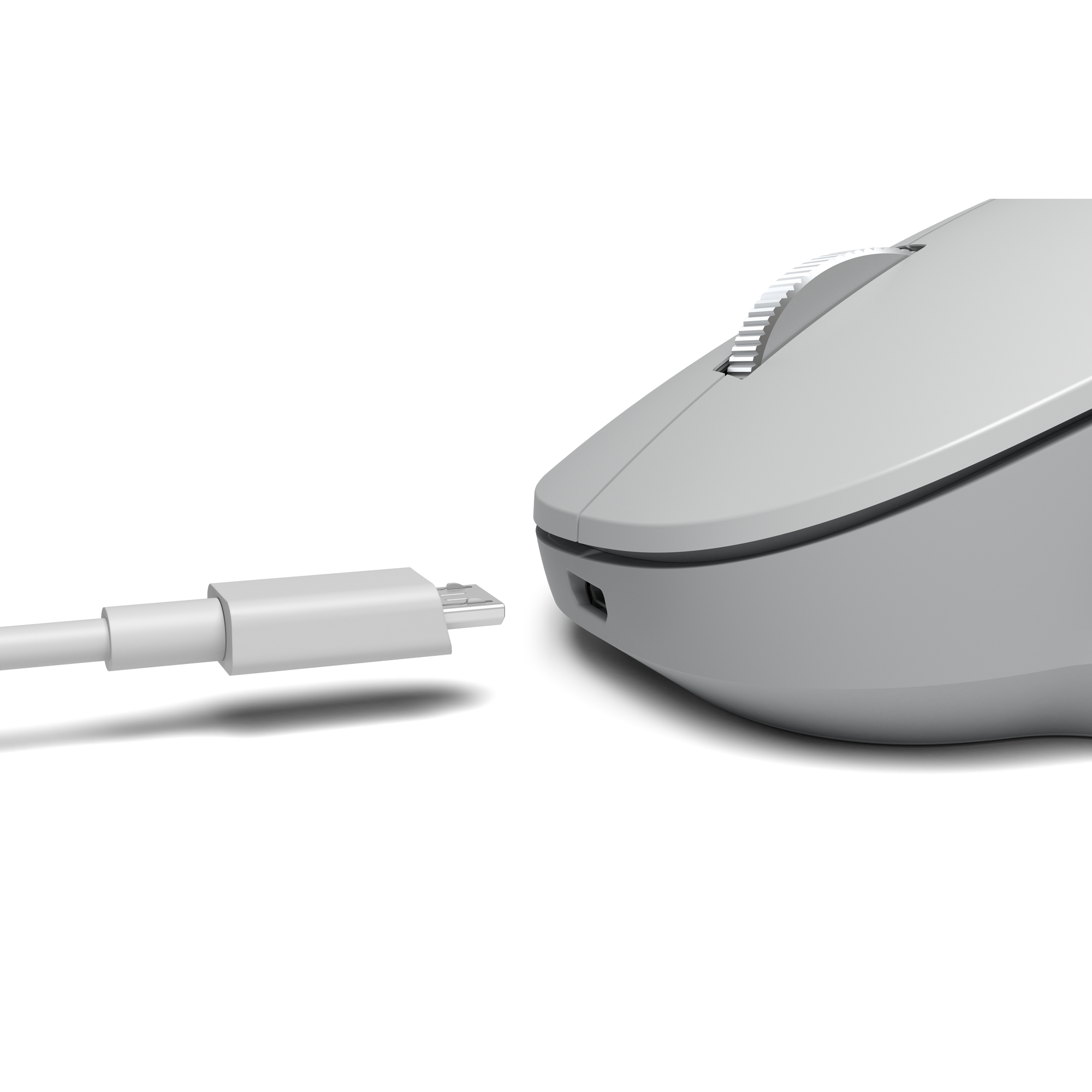 A gray computer mouse connected to a white USB-C cable. Black background.