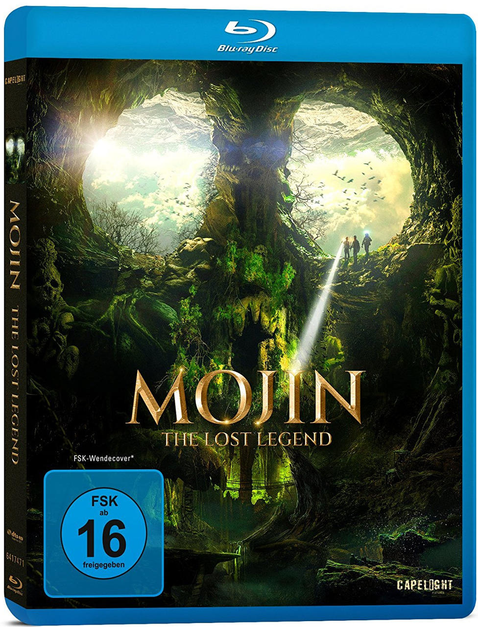Blu-ray-Filmcover. Ein grüner Wald mit drei Personen in der Ferne. Der Text lautet MOJIN.