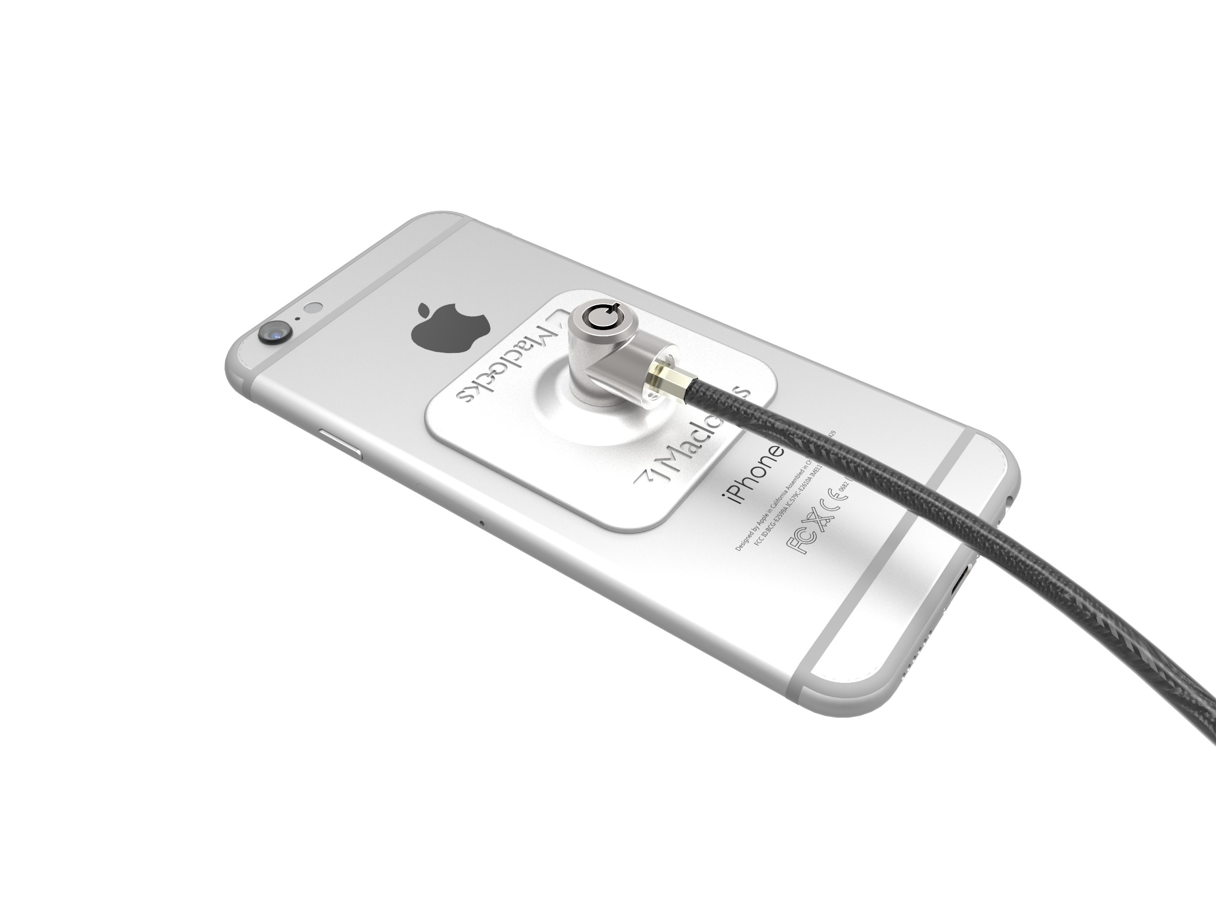 Ein silbernes iPhone mit angebrachtem Sicherheitsschloss auf der Rückseite. Ein Kabel ist verbunden.