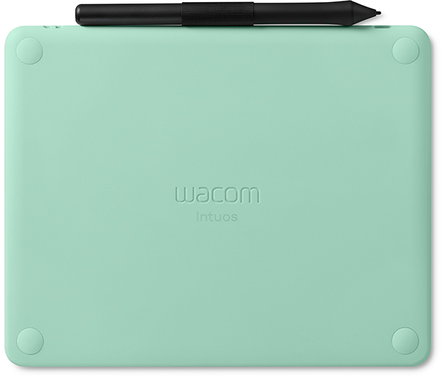 Egy mentazöld Wacom Intuos grafikus tábla, fekete tollal a tetején.