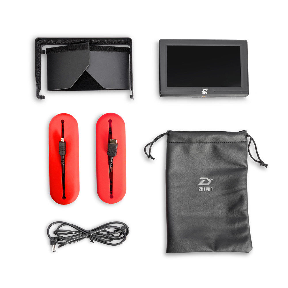 A top-down product shot shows a monitor kit with a sunshade, screen, red cable holders, a pouch, and power cable.
