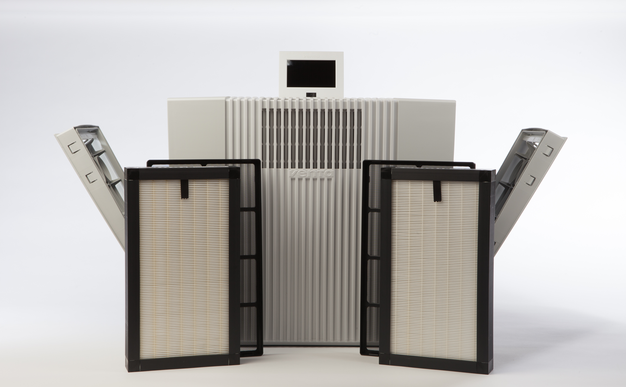 An air purifier with filters and a small screen.